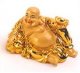 Ležící smějící se Buddha podávající zlatý ingot